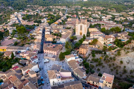 spain-mallorca-calvia-helicopter-view-of-parroquia-sant-joan-baptista-church-and-surrounding-buildings-AMF08496